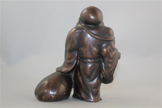 A Japanese bronze standing figure of Hotei, 19th century, 19cm